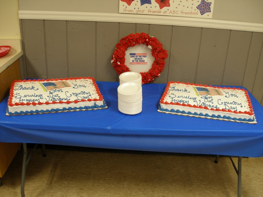Two Veterans Day cakes purchased for the free 2016 Veterans Day dinner hosted by Cottage Grove Post 8752, Veterans of Foreign Wars. 

The Buddy Poppy display was created by immediate past Auxiliary President Mary Anne Maggi. 